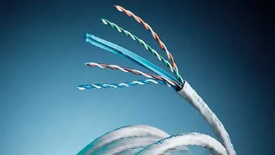 Stripped white ethernet cable, four twisted pairs of colored wires fanned out on a blue background.