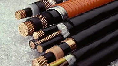 Close-up of cut industrial electrical cables, revealing copper wiring and insulation.